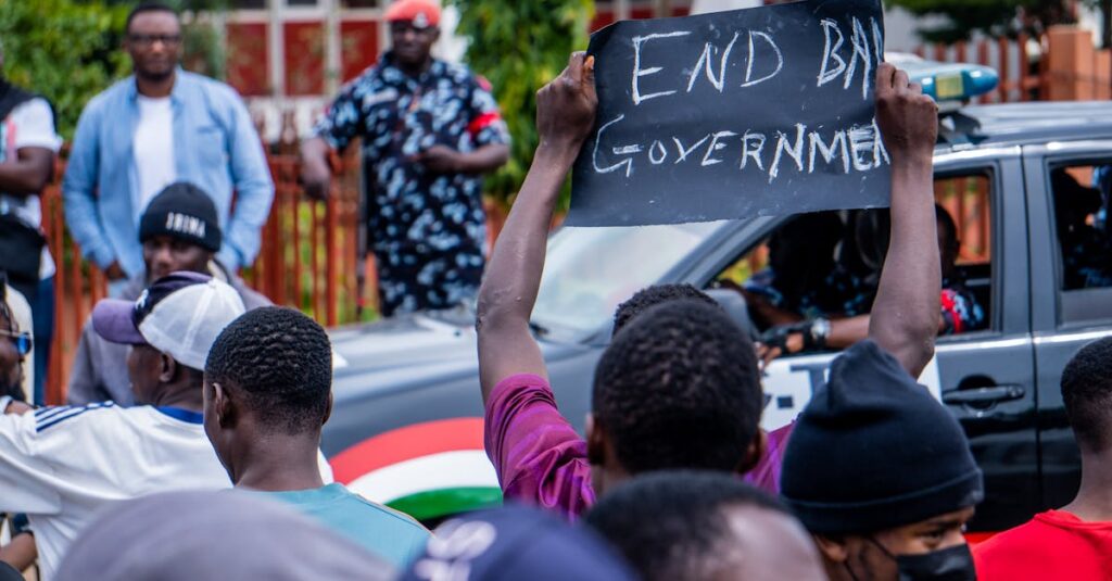 Demonstrators in Nigeria express political discontent with an 'End Bad Government' sign.
