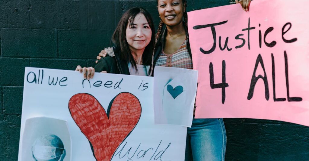 Two women holding signs for world peace and justice at a demonstration.